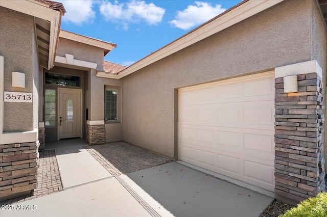 entrance to property featuring a garage