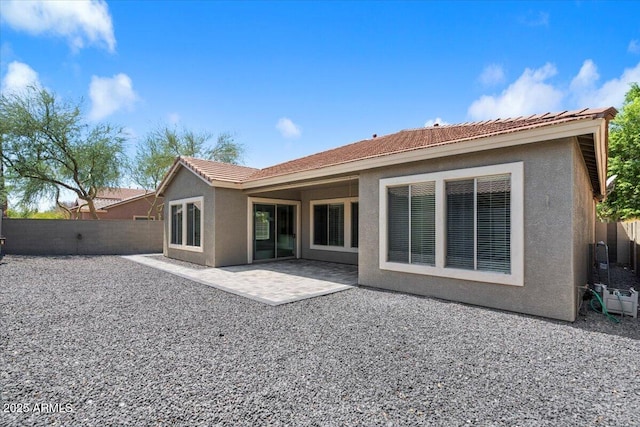 back of property with a patio area