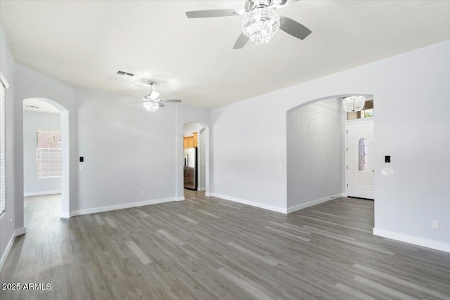 empty room featuring hardwood / wood-style floors and ceiling fan