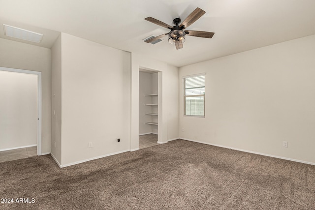 unfurnished bedroom featuring carpet and ceiling fan