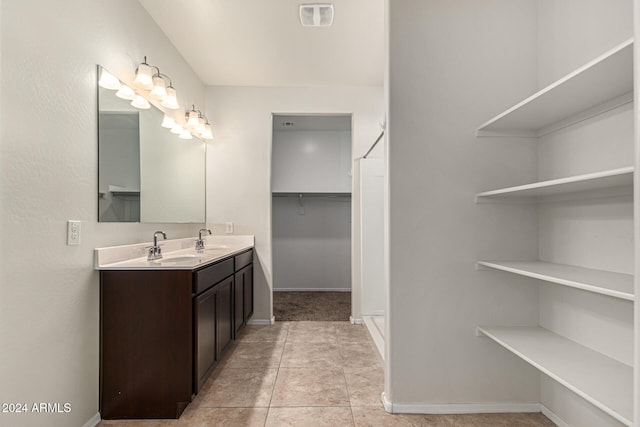 bathroom with vanity and tile patterned flooring