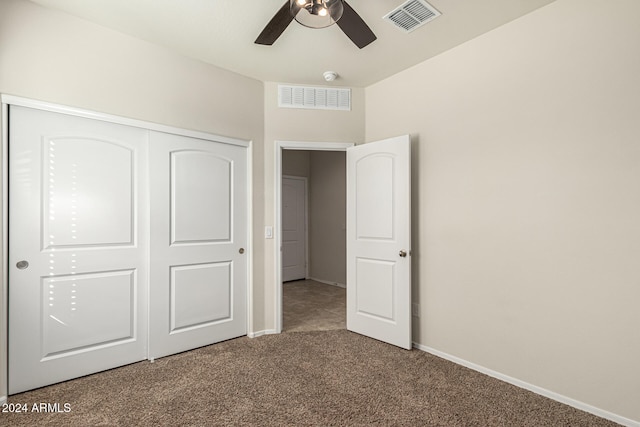 unfurnished bedroom with a closet, ceiling fan, and carpet