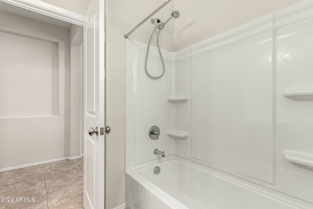 bathroom featuring bathtub / shower combination and tile patterned flooring