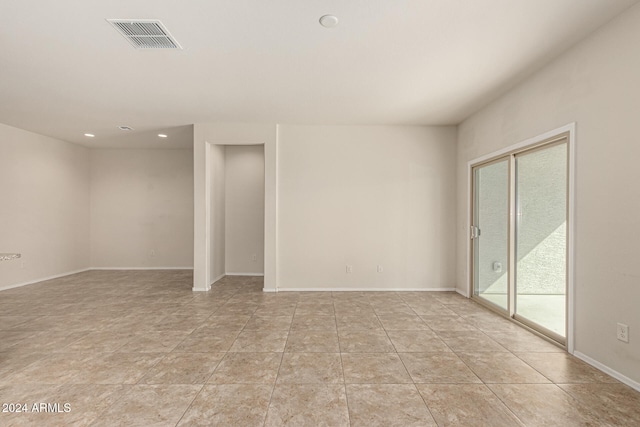 view of tiled spare room