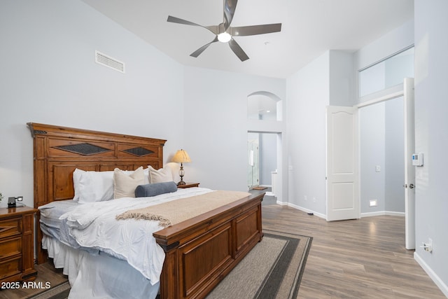 bedroom with hardwood / wood-style flooring and ceiling fan