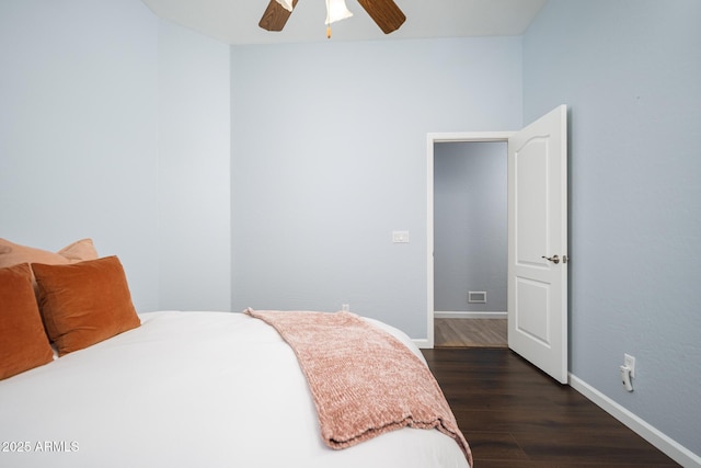 bedroom with ceiling fan and dark hardwood / wood-style floors