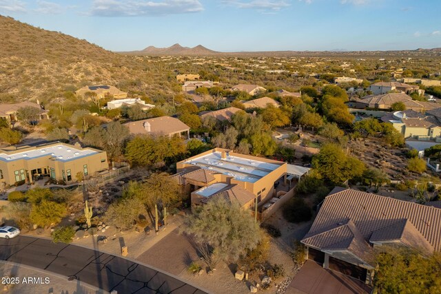 birds eye view of property with a mountain view