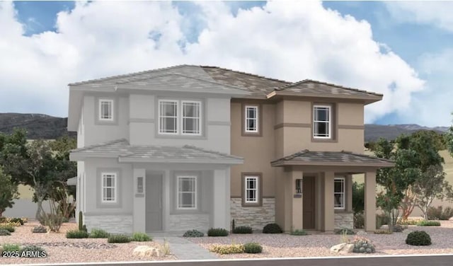 2805 N Claire Dr, Buckeye, AZ 85396 - view of front of house featuring a mountain view, stucco siding, and stone siding