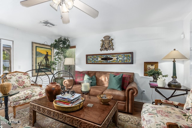 living room featuring ceiling fan and hardwood / wood-style floors