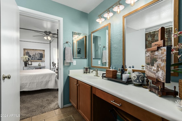 bathroom featuring vanity, ceiling fan, and tile patterned flooring