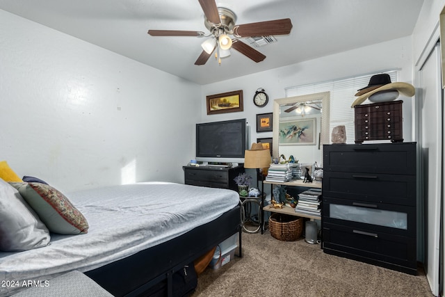 bedroom with light carpet, a closet, and ceiling fan