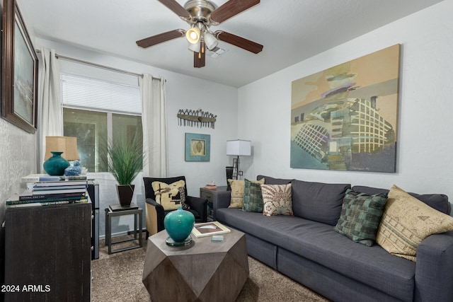 living room featuring carpet flooring and ceiling fan