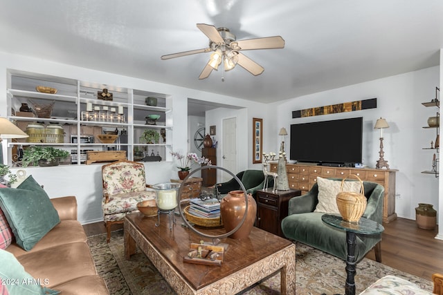 living room with ceiling fan and wood-type flooring