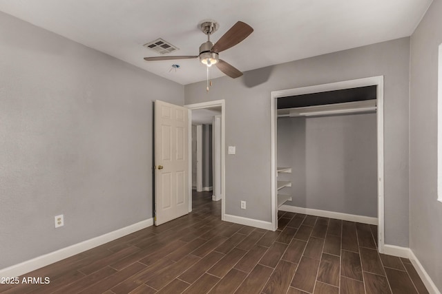 3402 W Tonto St W, Phoenix, AZ 85009 - unfurnished bedroom featuring dark wood-style floors, a closet, and a ceiling fan