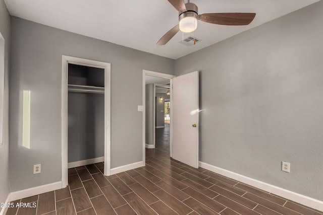 3402 W Tonto St W, Phoenix, AZ 85009 - unfurnished bedroom featuring wood tiled floors, a closet, and a ceiling fan