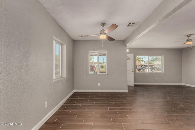 3402 W Tonto St W, Phoenix, AZ 85009 - unfurnished room with a ceiling fan, wood tiled floors, and a textured wall