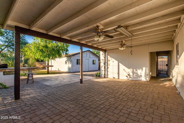 3402 W Tonto St W, Phoenix, AZ 85009 - view of patio featuring an outbuilding and a ceiling fan