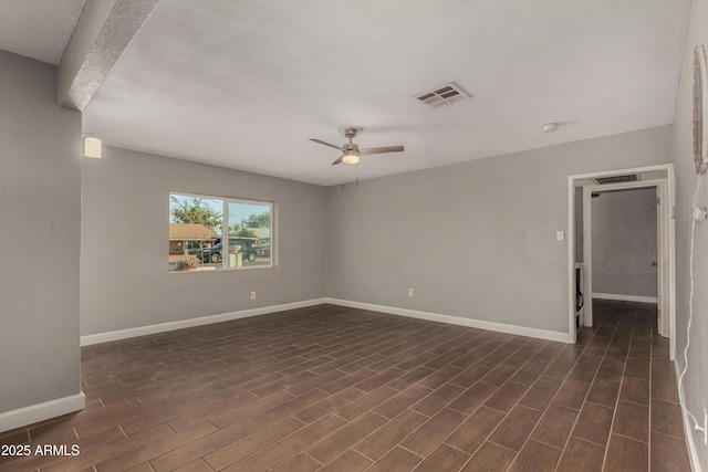 3402 W Tonto St W, Phoenix, AZ 85009 - empty room featuring a ceiling fan, dark wood finished floors, and a smoke detector