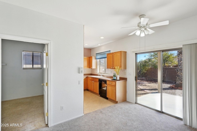 kitchen with dishwasher, light carpet, tasteful backsplash, and ceiling fan