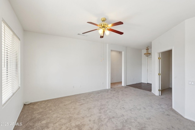 interior space with ceiling fan