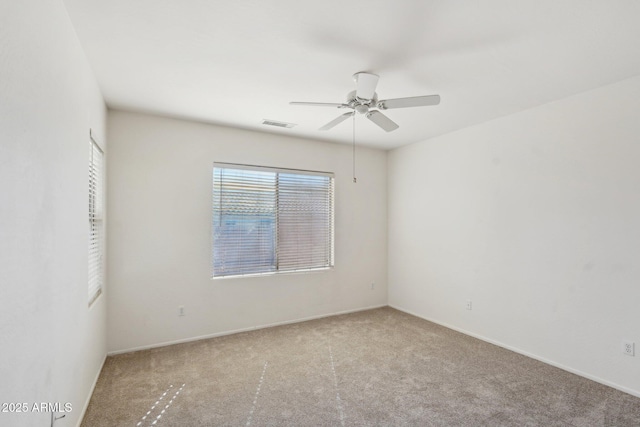 unfurnished room with ceiling fan and light colored carpet