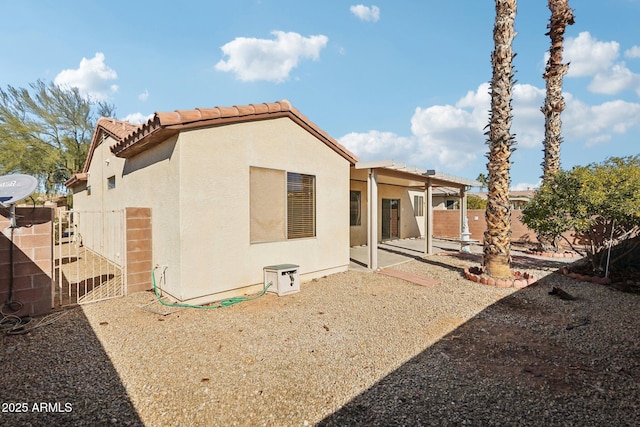 back of house featuring a patio area