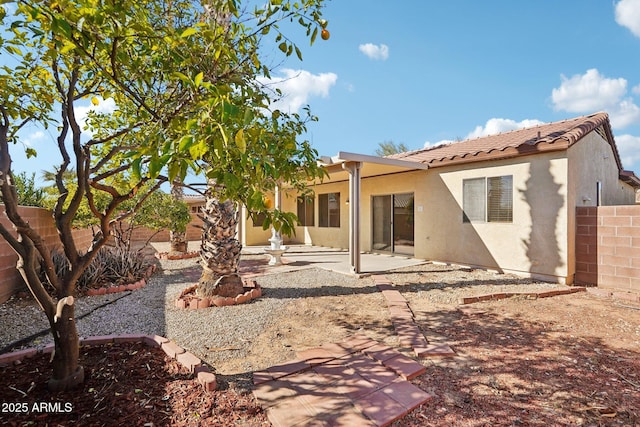 back of property featuring a patio