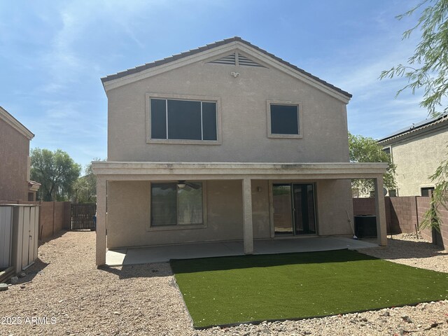 23284 W Pima St, Buckeye, AZ 85326 - rear view of house featuring stucco siding, a patio, a ceiling fan, and a fenced backyard