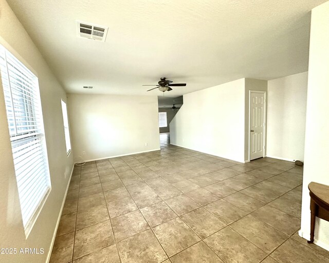 23284 W Pima St, Buckeye, AZ 85326 - spare room with ceiling fan and tile patterned flooring