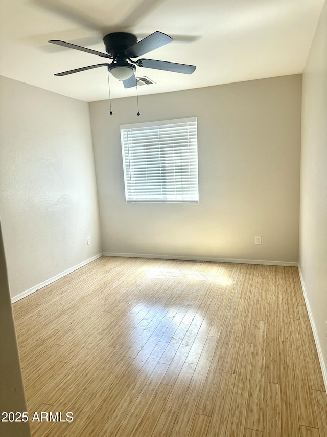 23284 W Pima St, Buckeye, AZ 85326 - empty room featuring wood finished floors and ceiling fan