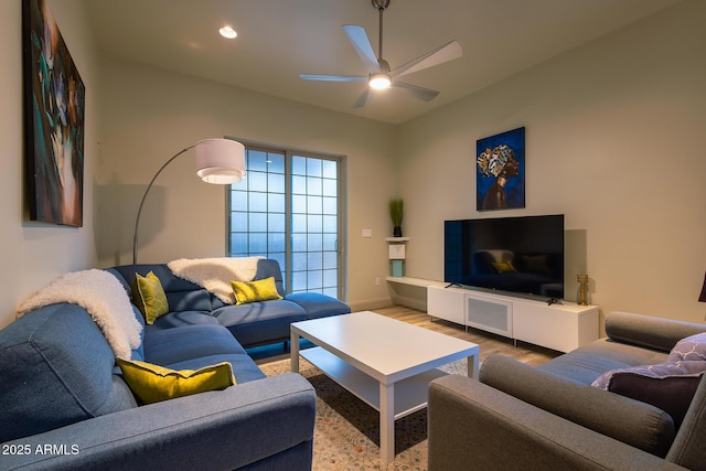 living area featuring wood finished floors, ceiling fan, baseboards, and recessed lighting