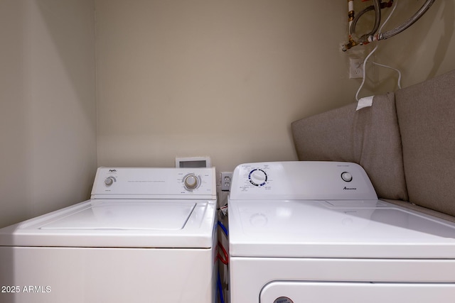 laundry room featuring laundry area and washing machine and clothes dryer