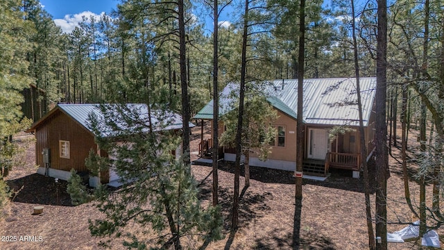 view of home's exterior featuring metal roof and a standing seam roof