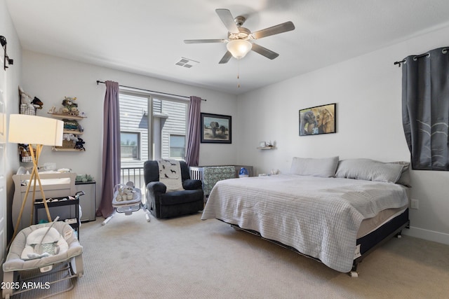 carpeted bedroom featuring visible vents and ceiling fan
