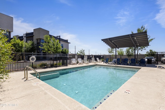 pool with fence and a patio