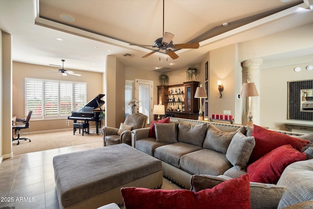 living room with light colored carpet, ceiling fan, and ornate columns