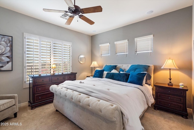 carpeted bedroom featuring ceiling fan