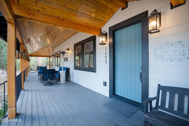 wooden deck featuring covered porch