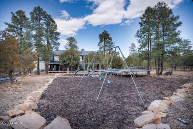 communal playground featuring a trampoline