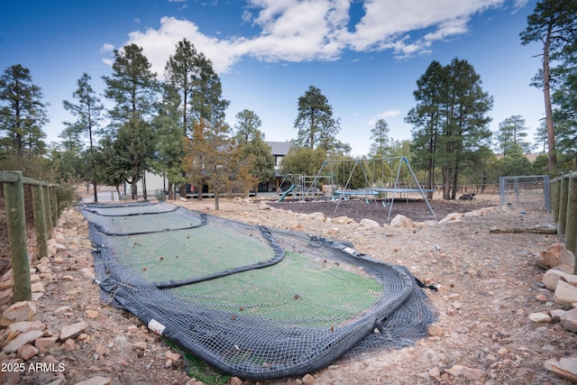 exterior space featuring fence and playground community