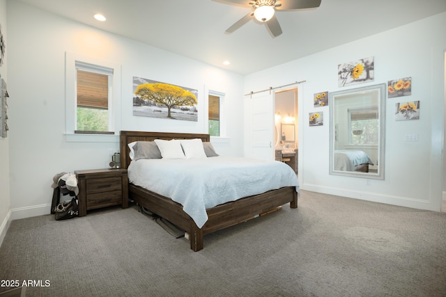 bedroom with carpet floors, a barn door, baseboards, and recessed lighting