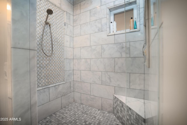 bathroom featuring tiled shower