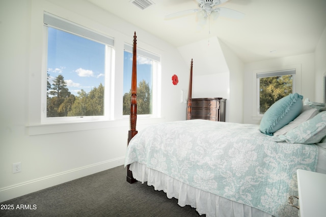 bedroom featuring baseboards, visible vents, dark carpet, and a ceiling fan