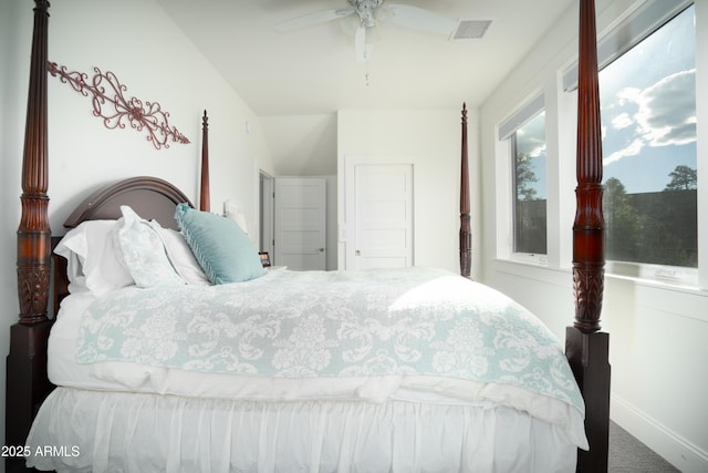 bedroom with carpet floors, ceiling fan, visible vents, and baseboards