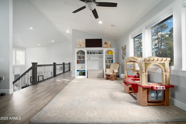 rec room featuring visible vents, baseboards, wood finished floors, vaulted ceiling, and recessed lighting