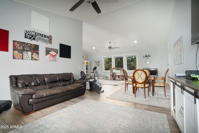 living room featuring a ceiling fan, recessed lighting, high vaulted ceiling, and wood finished floors