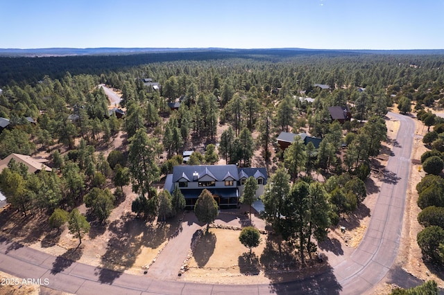 aerial view featuring a view of trees