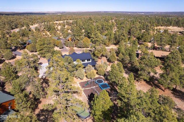 aerial view featuring a forest view