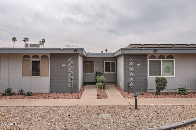 view of front of home featuring brick siding