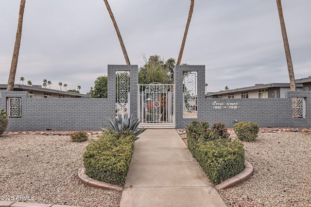 view of gate featuring fence